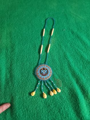Beaded thunderbird rosette medallion necklace with bone hairpipe and cowrie shell drops, plate 108