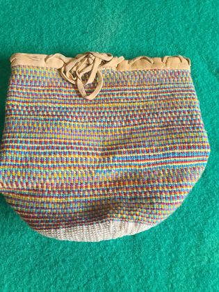 Plateau-style twined wool "sally bag" with hide-bound rim, plate 171
