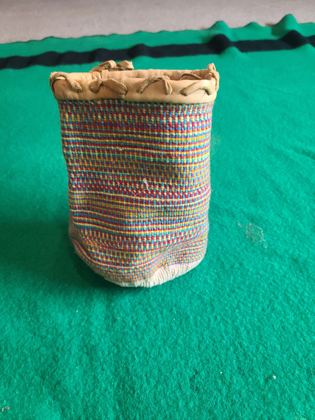 Plateau-style twined wool "sally bag" with hide-bound rim, plate 173