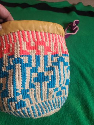 Plateau twined yarn round bag ("sally bag" form) with buckskin rim, plate 18