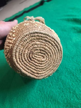 Imbricated coiled cedar-root berry basket with looped rim and buckskin ties, plate 183