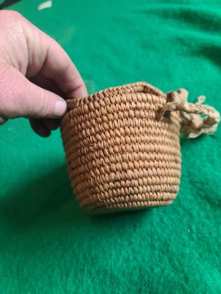 Small plain coiled cedar-root basket with cordage loops, plate 185