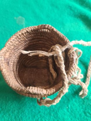 Small plain coiled cedar-root basket with cordage loops, plate 187