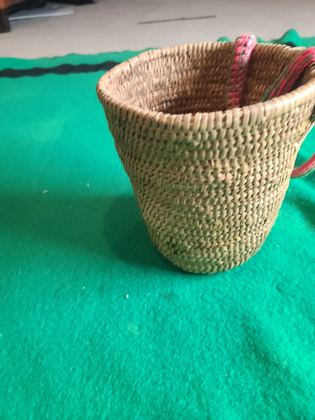 Coiled cedar-root gathering basket with crocheted yarn rim and handle, plate 193