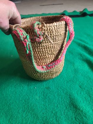 Coiled cedar-root gathering basket with crocheted yarn rim and handle, plate 194
