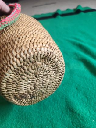 Coiled cedar-root gathering basket with crocheted yarn rim and handle, plate 196