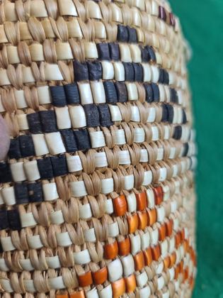 Fully imbricated coiled cedar-root berry basket with hide rim loops, plate 200