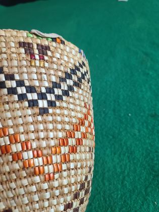 Fully imbricated coiled cedar-root berry basket with hide rim loops, plate 201