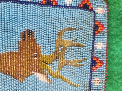 Beaded pictorial panel with bull elk on blue ground, plate 42