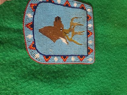 Beaded pictorial panel with bull elk on blue ground, plate 43