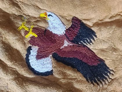 Beaded hide vest with pictorial bald eagle and hourglass front panels, plate 57