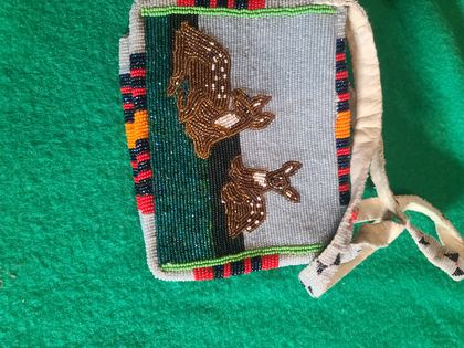 Pictorial beaded bag with two elk or deer before a forest